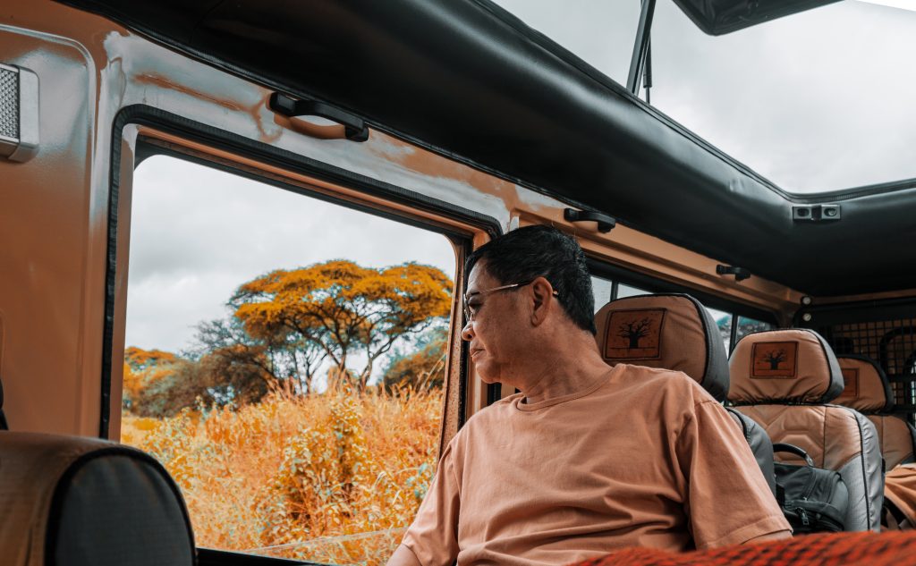 Tourist enjoying a game drive in Serengeti National Park